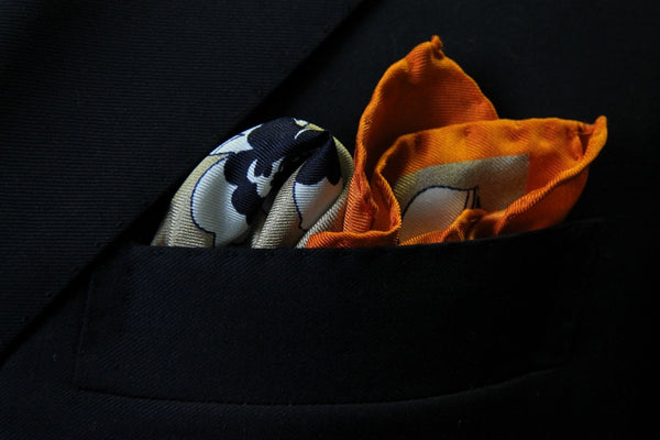 Battisti Pocket Square: Orange with black & white floral pattern, pure silk