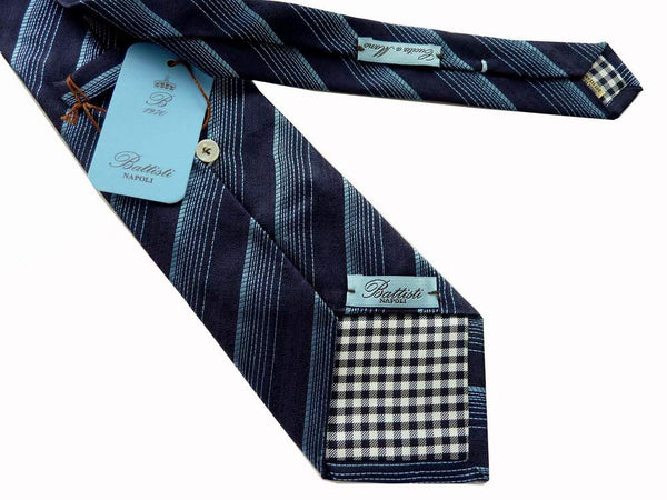 Battisti Tie: Navy with light blue varied stripes, 1-button & pocket, pure silk