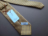 Battisti Tie: Dull yellow with navy floral pattern, pure silk